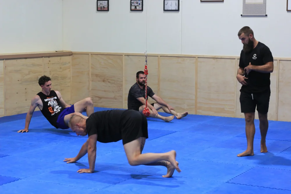 Crawling during adult functional fitness class in Eltham Australia. Crawling during adult functional fitness class in Eltham Australia.