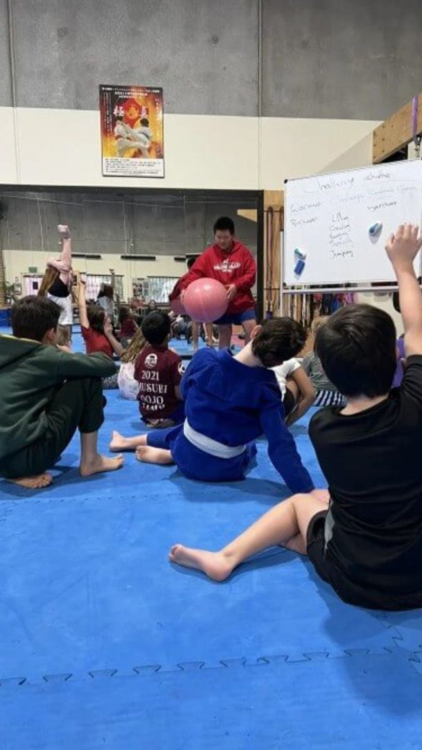group of kids learning leadership skills in fitness class in eltham australia group of kids learning leadership skills in fitness class in eltham australia