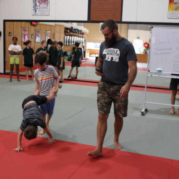 Willem facilitating engaging functional fitness activities for children at Eltham Martial Arts