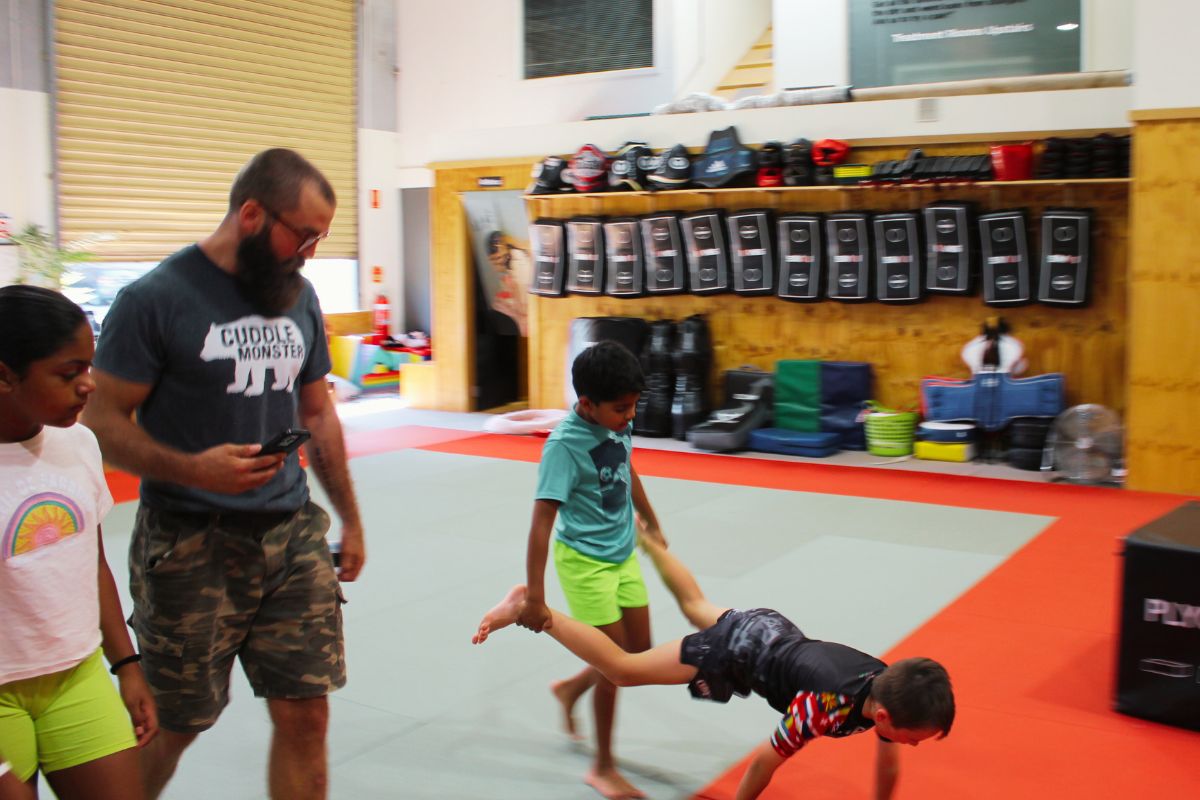 What Ive Learned From Running Neurodivergent Kids Fitness Classes So Far Coach guiding neurodivergent kids through a functional fitness activity at Functional Fitness Eltham. Real moments, movement, and support in action.